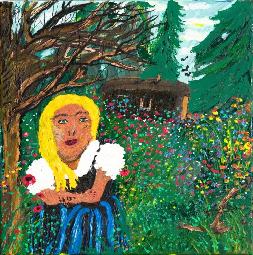 Blonde girl in the forest in front of a flower meadow
